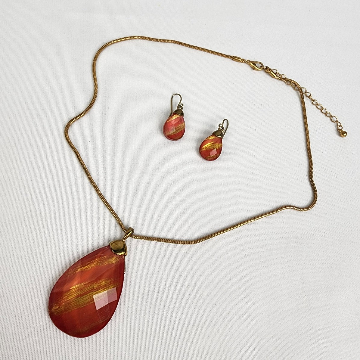 Gold Tone Red Faceted Stone Pendant Necklace & Earrings
