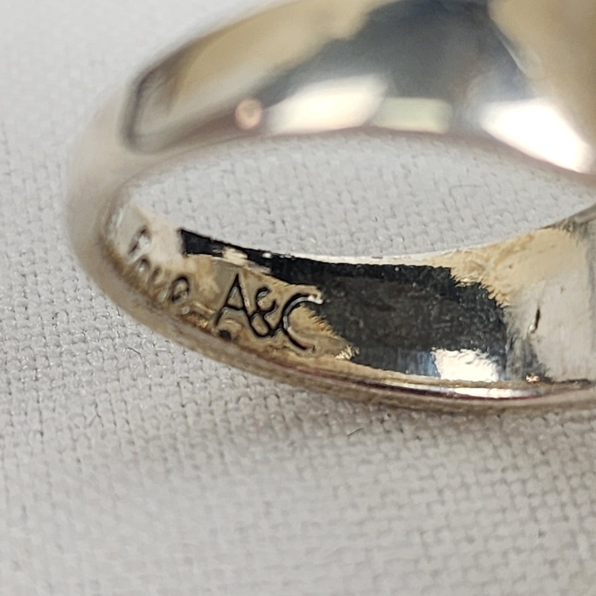 A&C Adjustable Ring with Large Faceted Triangle Glass Stone