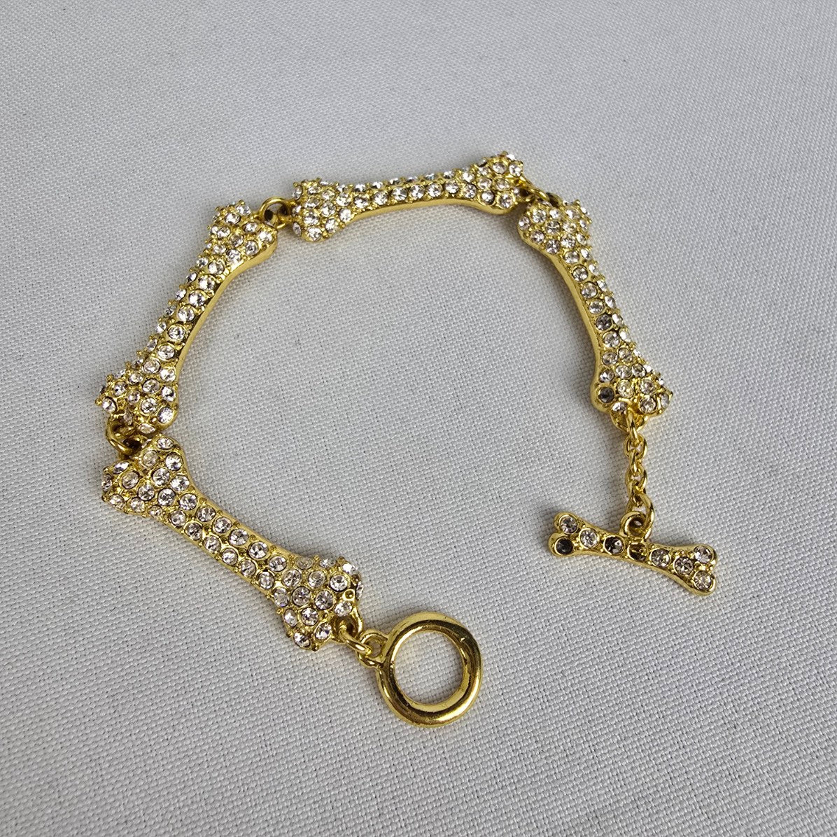 Gold Tone Crystal Dog Bone Link Toggle Bracelet