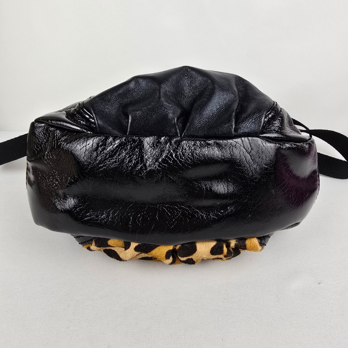 The Sak Black Leather Animal Print Pouch Crossbody Purse