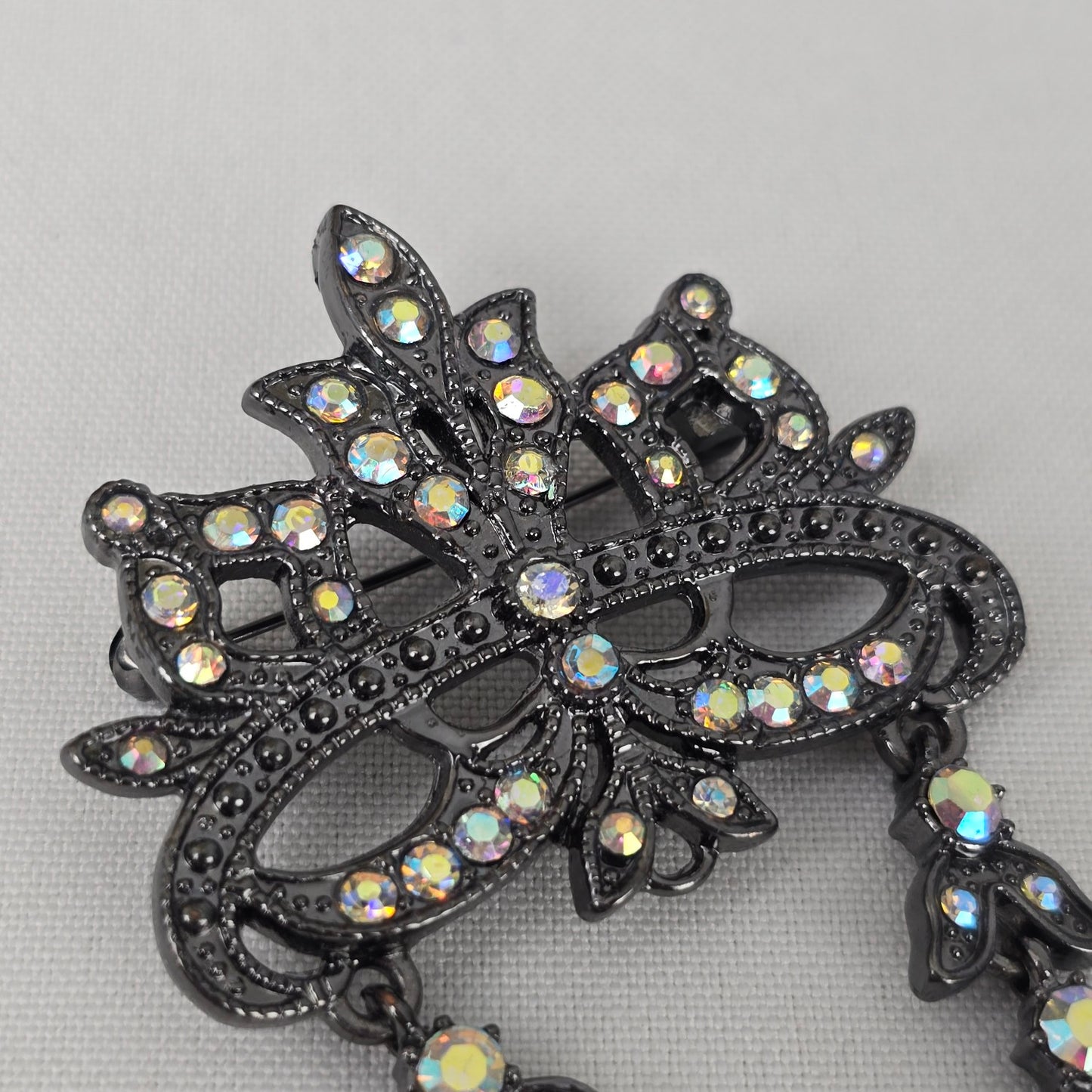 Black & AB Rhinestone Mask Brooch
