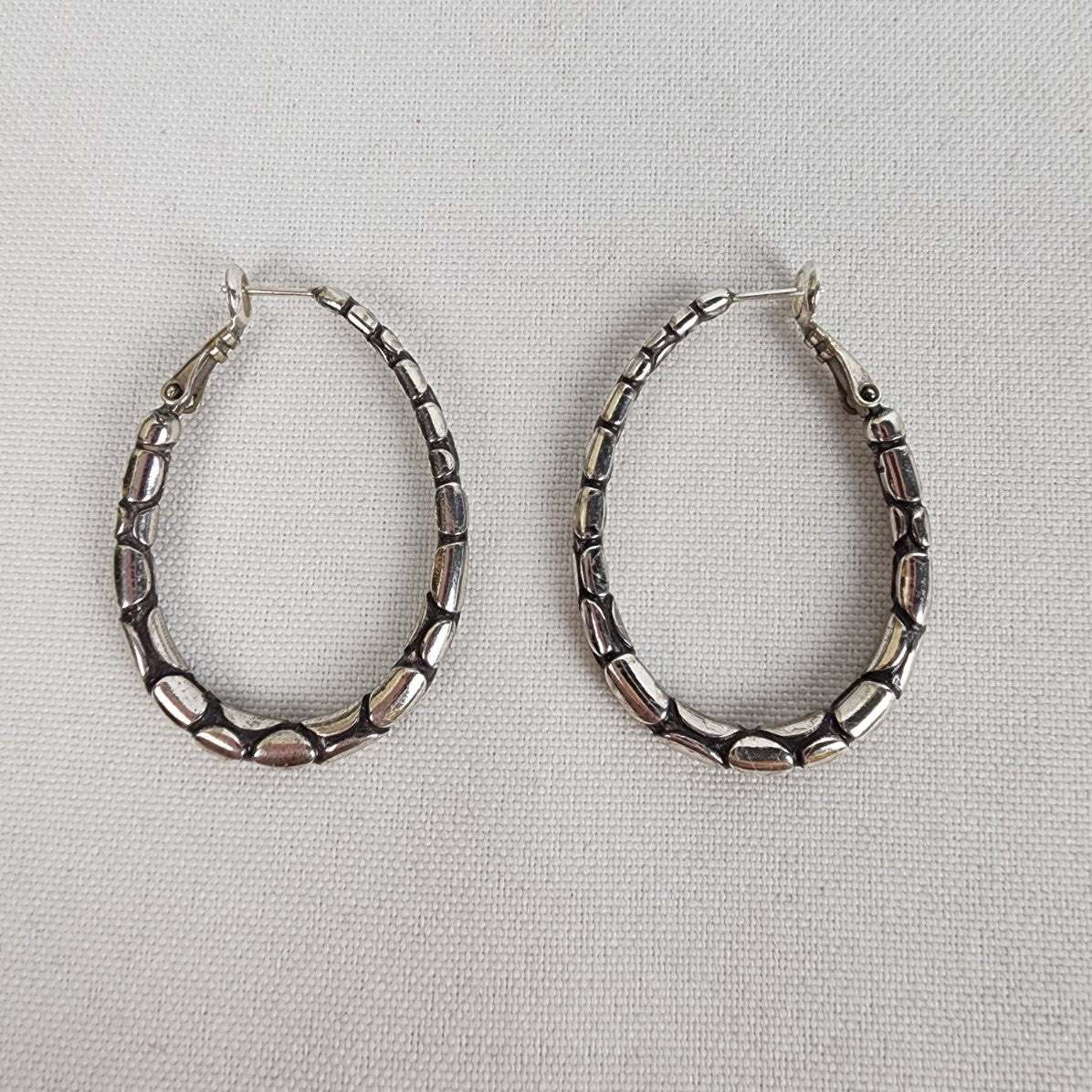 Silver Tone Pebble Oval Hoop Earrings