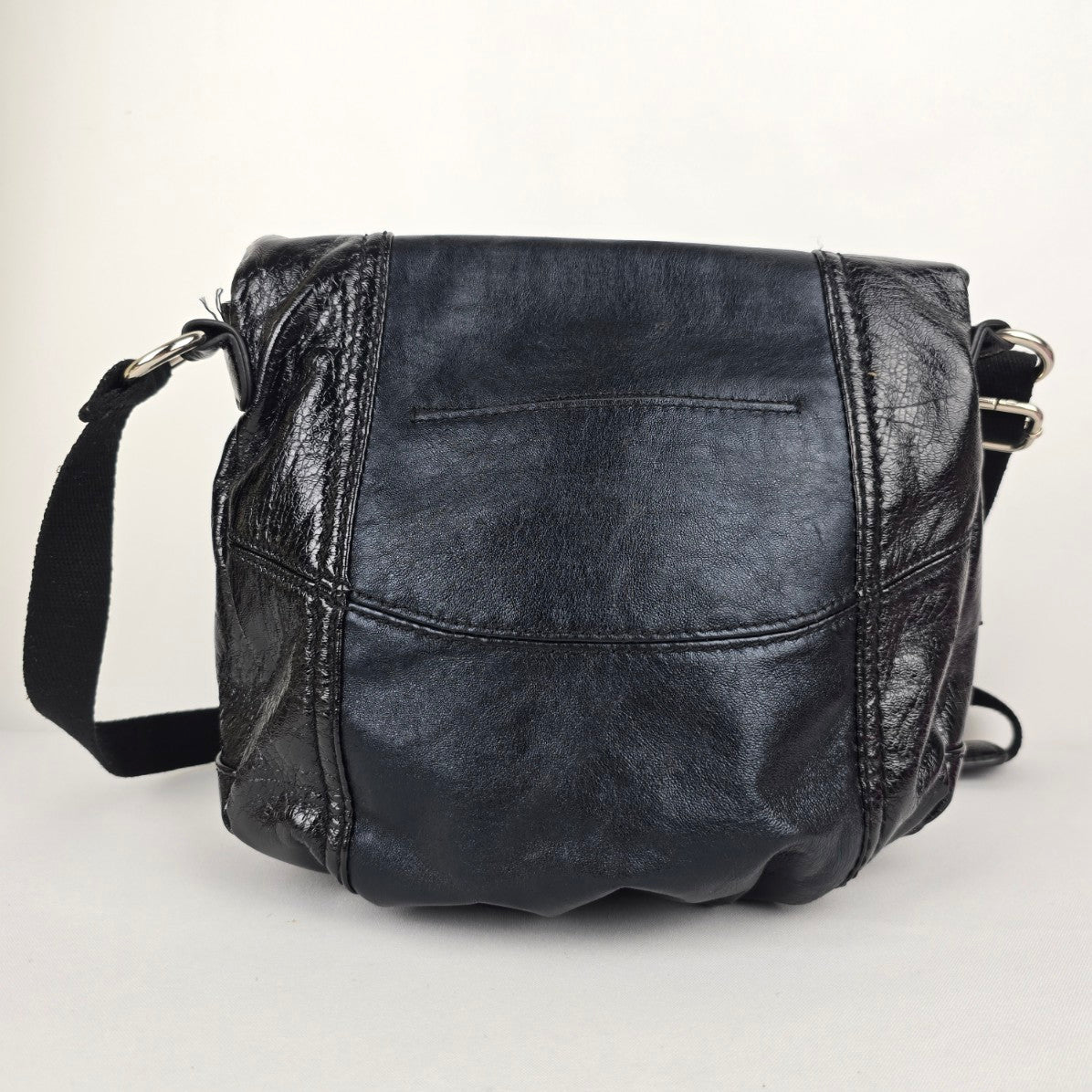 The Sak Black Leather Animal Print Pouch Crossbody Purse