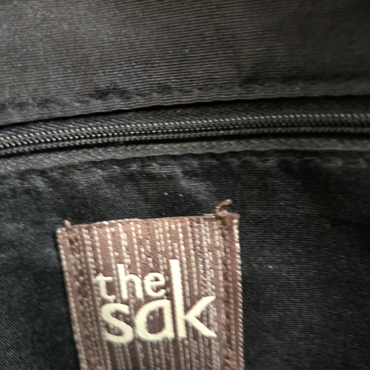The Sak Black Leather Animal Print Pouch Crossbody Purse