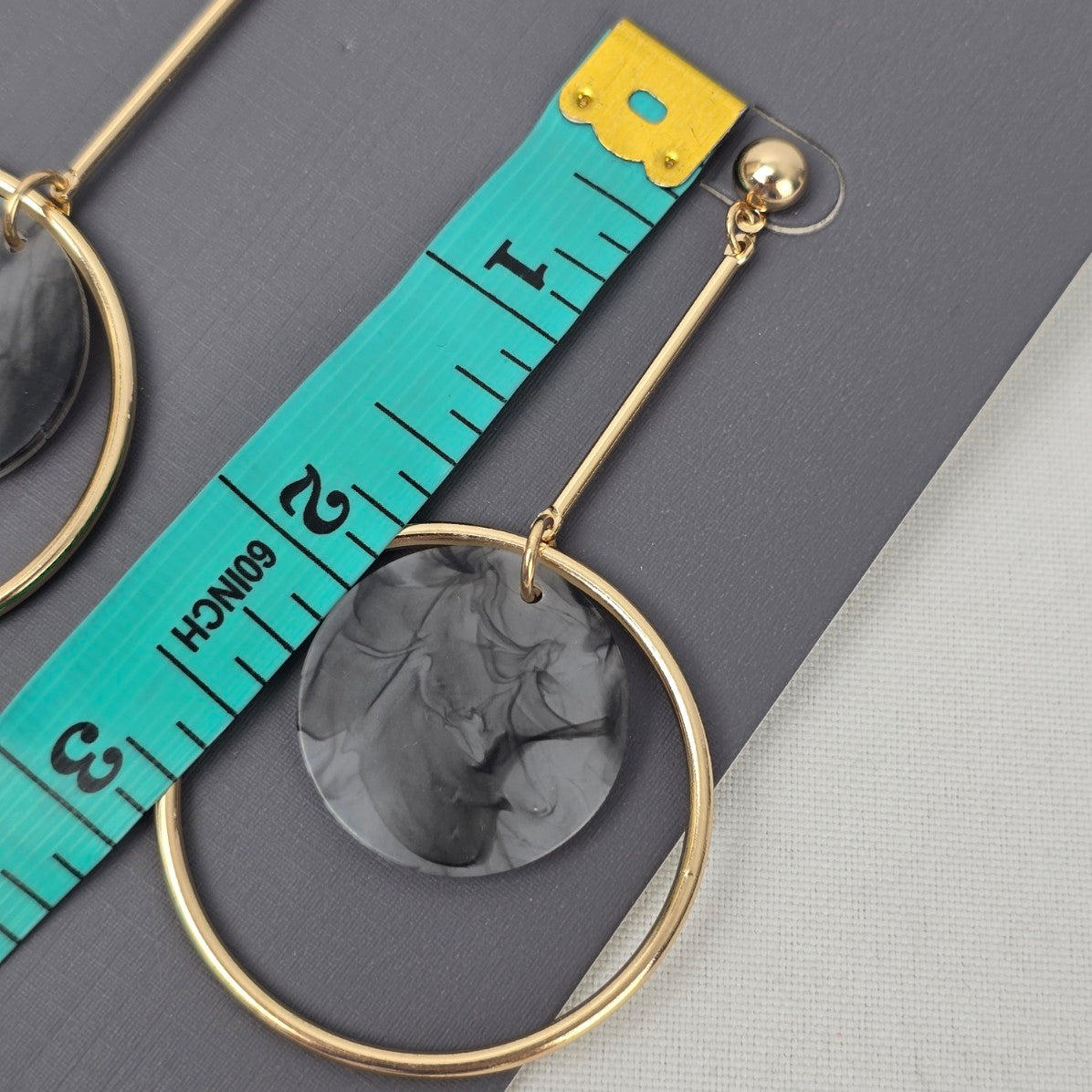 Etereo Gold Tone Grey Swirl Drop Earrings