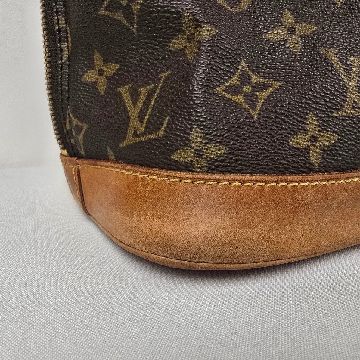Louis Vuitton Alma Monogram Top Handle Satchel Purse