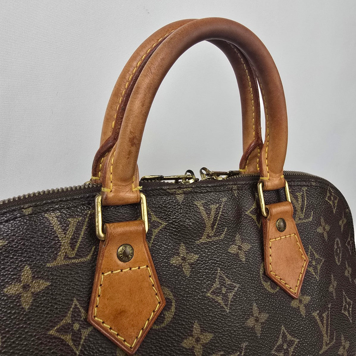 Louis Vuitton Alma Monogram Top Handle Satchel Purse