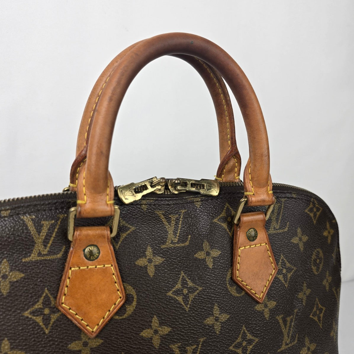 Louis Vuitton Alma Monogram Top Handle Satchel Purse