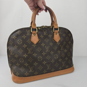 Louis Vuitton Alma Monogram Top Handle Satchel Purse