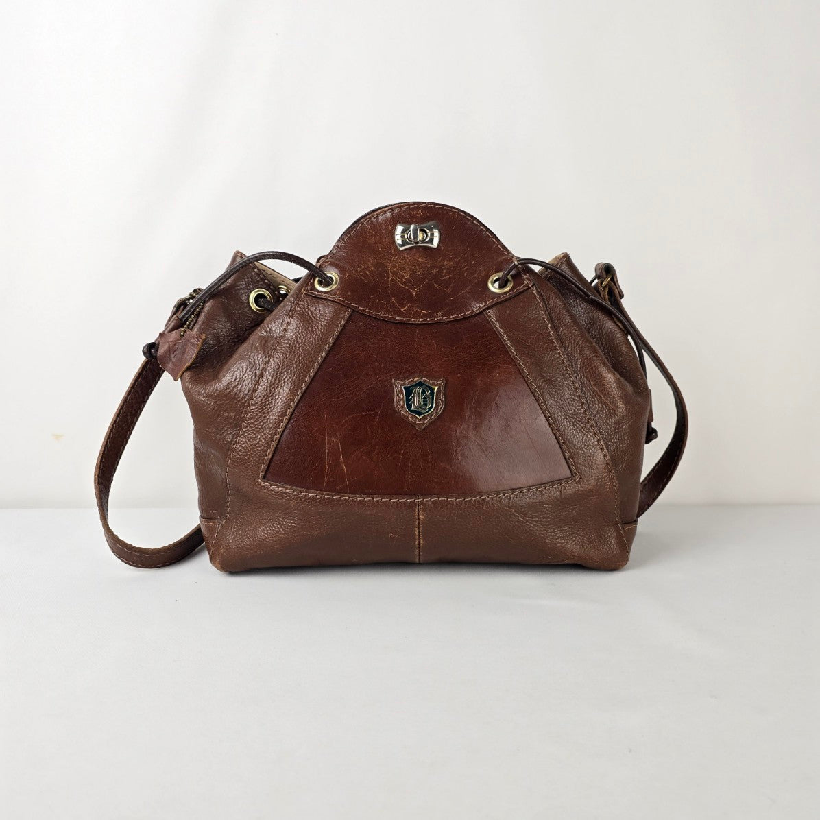 Vintage Brown Leather Drawstring Bag Crest Detail Slouchy Boho Crossbody