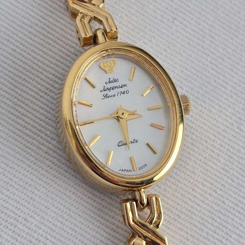 Jules Jürgensen Ladies Gold Tone Watch with Purple Gemstone Bracelet