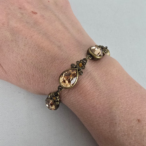 Myka Antiqued Brass Tone Champagne Crystal Teardrop Link Bracelet Floral