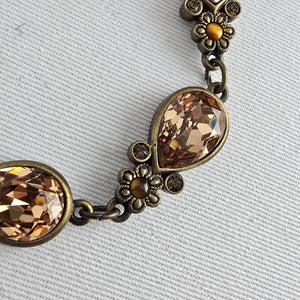 Myka Antiqued Brass Tone Champagne Crystal Teardrop Link Bracelet Floral