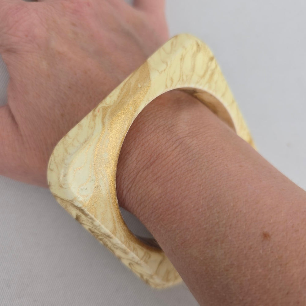 Cream Marbled Square Bangle Bracelet with Gold-Tone Swirl Detail