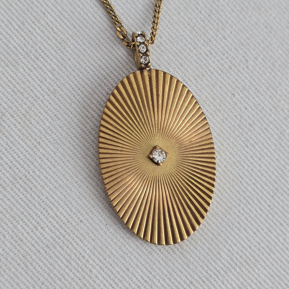 Stella & Dot Starstruck Charm Gold Tone Oval Sunburst Rhinestone Pendant Necklace