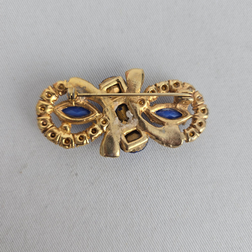Vintage Czech Unsigned Sapphire Blue Glass Marquise Cabochon Bow Brooch Gold Tone Pin